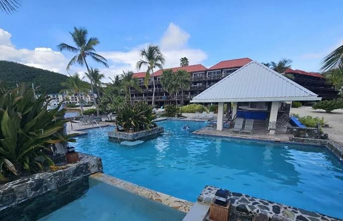 Sapphire Beach Resort and Marina pool deck with palm trees and turquoise water, St. Thomas USVI